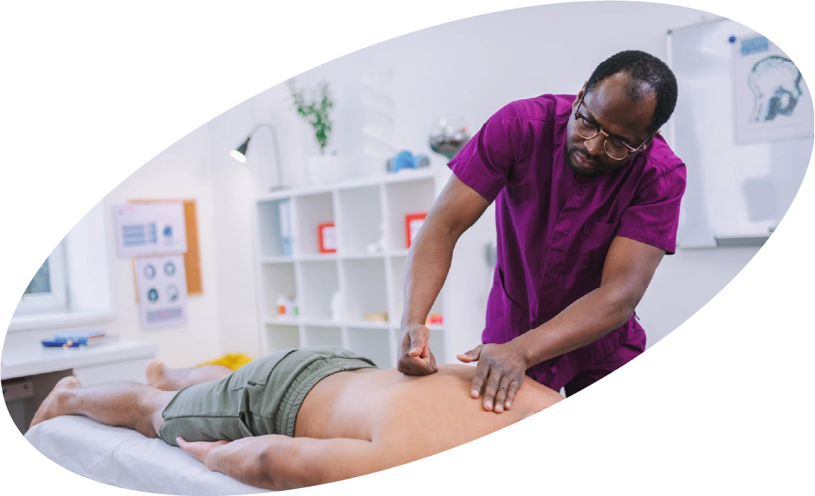 Massage therapist treating a client