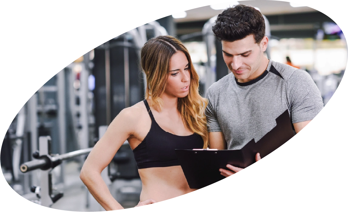 Personal trainer working with a client